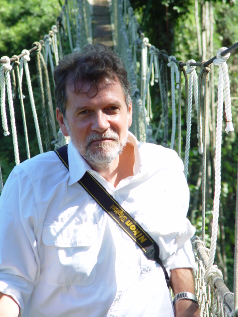 Dr.John Kress walking in the rainforest